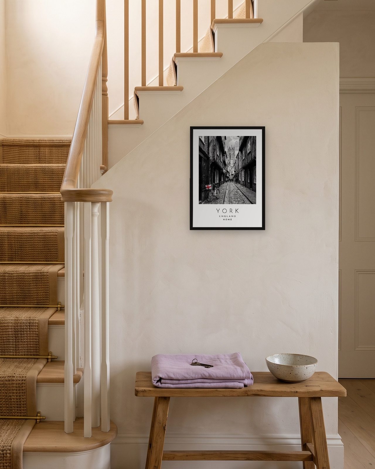 Our Trip York print: black frame A3 on a staircase wall, personalised HOME